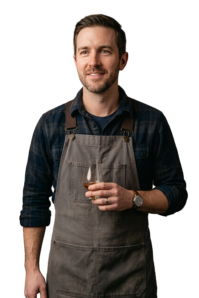 A St. Petersburg brewery owner with a glass of his beer, back to the work he loves